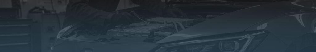 Mechanic working on car engine